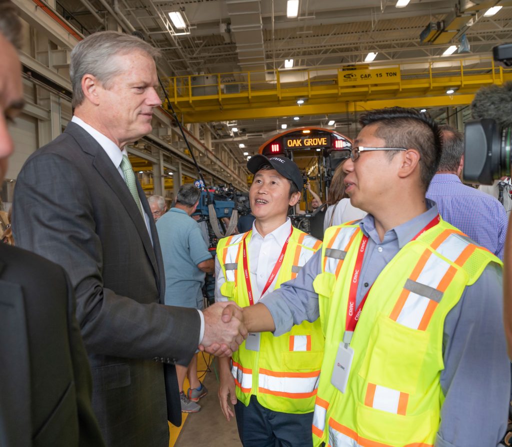 Govenor Baker shaking hands with CRRC employees